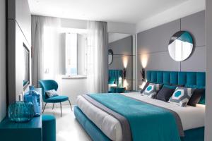 Postel nebo postele na pokoji v ubytování Hotel Plaza e de Russie - Relais & Châteaux