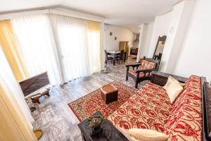 a living room with a couch and a table at Apartment Prince in Mostar
