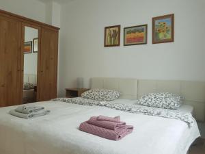 a bedroom with two beds with towels on it at Lina Mogan in Puerto de Mogán