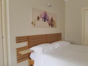 Postel nebo postele na pokoji v ubytování Residence Campo Rotondo