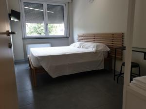Postel nebo postele na pokoji v ubytování Residence Campo Rotondo