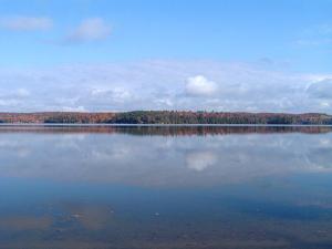 a large body of water with trees in the background at Marble Lake Lodge in Cloyne