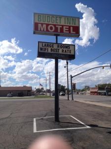 a sign for a burger inn motel in a parking lot at Budget Inn in Green River