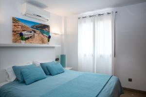 Postel nebo postele na pokoji v ubytování Apartaments Delfin