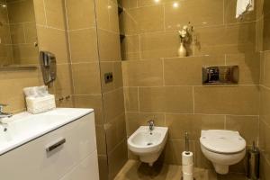 Koupelna v ubytování Apartaments Delfin