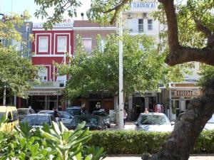 a city street with cars parked in front of buildings at Hostal La Barraca in Valencia