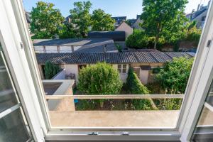 a view from the window of a house at Maison 88 m2 le patio du centre ville avec garage in Tours