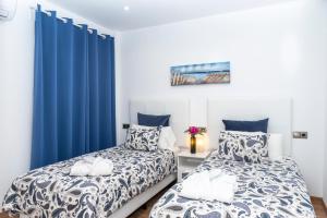 Postel nebo postele na pokoji v ubytování Apartaments Delfin