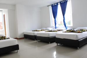 Ένα ή περισσότερα κρεβάτια σε δωμάτιο στο HOTEL MANAGER OBELISK