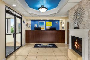 a lobby of a hospital with a fireplace at Days Inn by Wyndham Weldon Roanoke Rapids in Weldon