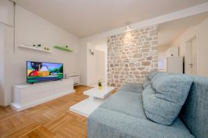 TV a/nebo společenská místnost v ubytování Villa Santino