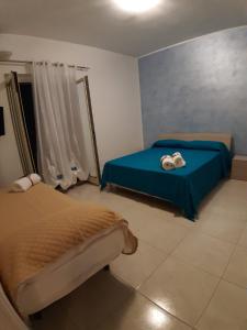 A bed or beds in a room at Le Quattro Rose Még 37 kép