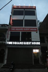 a building with a sign that reads time square guest house at Time Square Guest House in Jalandhar
