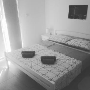 Postel nebo postele na pokoji v ubytování Apartman Bunarić