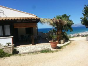 a house with a view of the ocean at Blunda Holiday Home in Castellammare del Golfo