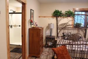 a bedroom with a bed and a dresser and a dresser at Inn at the River in Wausau
