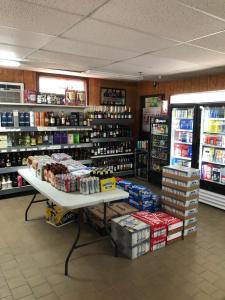 a store aisle with shelves of food and drinks at Best Budget Inn Owatonna in Owatonna
