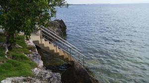 a staircase leading down to the water on a cliff at Panglao Sea Resort - Tangnan in Panglao