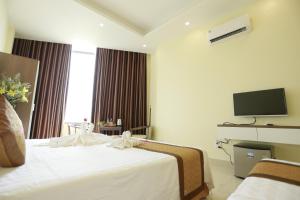 TV a/nebo společenská místnost v ubytování Anova 2 Hotel