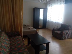 Uma área de estar em Apartment Khimshiashvili 9