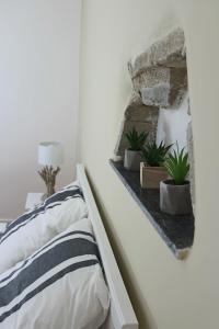 Postel nebo postele na pokoji v ubytování La Folie des Remparts