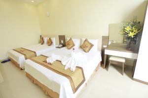 Postel nebo postele na pokoji v ubytování Anova 2 Hotel