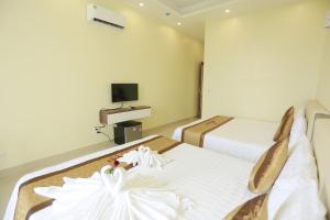 TV a/nebo společenská místnost v ubytování Anova 2 Hotel