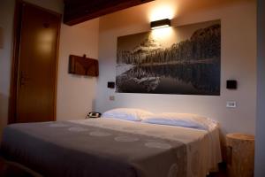 Postel nebo postele na pokoji v ubytování Albergo Meublè Victoria