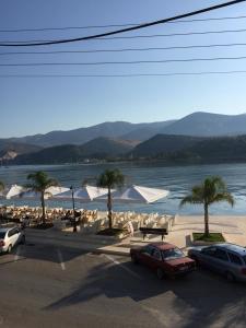 a parking lot with a view of a body of water at Turtle harbour Seafront Apartment! Full Seaview!!! in Argostoli