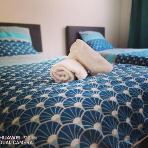 Säng eller sängar i ett rum på Le Grand Appart' Toulon