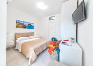 Postel nebo postele na pokoji v ubytování B&B La Gioia