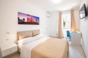 Postel nebo postele na pokoji v ubytování B&B La Gioia
