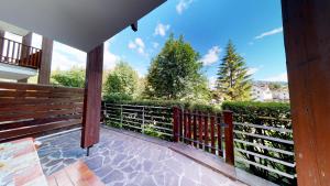 a balcony of a house with a fence at Apartment Sissi in Badia +1 photo