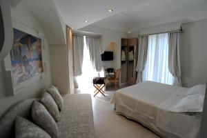 Postel nebo postele na pokoji v ubytování Minori Palace