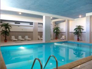 a large swimming pool in a hotel room at Cerro Mar Atlantico & Cerro Mar Garden in Albufeira