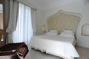Postel nebo postele na pokoji v ubytování Minori Palace