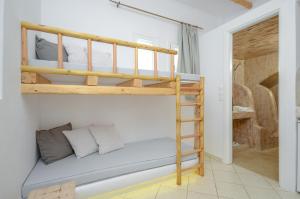Valena Mare Suites & Apartments客房内的一张或多张床位