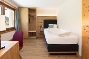 Postel nebo postele na pokoji v ubytování Boutique-Hotel Vincenz