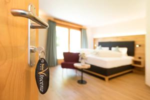 Postel nebo postele na pokoji v ubytování Boutique-Hotel Vincenz