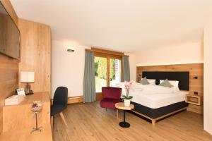 Postel nebo postele na pokoji v ubytování Boutique-Hotel Vincenz