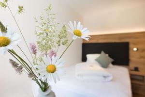 Postel nebo postele na pokoji v ubytování Boutique-Hotel Vincenz