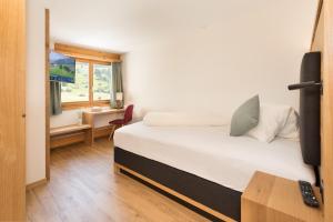 Postel nebo postele na pokoji v ubytování Boutique-Hotel Vincenz