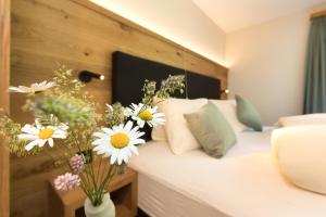 Postel nebo postele na pokoji v ubytování Boutique-Hotel Vincenz