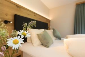 Postel nebo postele na pokoji v ubytování Boutique-Hotel Vincenz