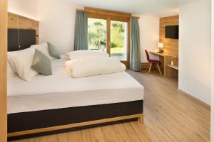 Postel nebo postele na pokoji v ubytování Boutique-Hotel Vincenz