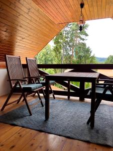 two chairs and a table in a room with a window at VILLA ANGEL in Rožňava