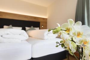 Postel nebo postele na pokoji v ubytování Boutique-Hotel Vincenz