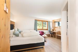Postel nebo postele na pokoji v ubytování Boutique-Hotel Vincenz