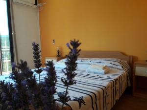 a bedroom with a bed with a pillow on it at Villa Welcome in Vrboska