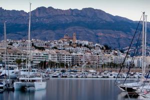 a group of boats docked in a harbor with a city at Ocean Lounge in Altea
